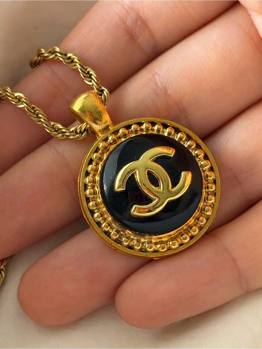 CHANEL Gold and Black Round CC Medallion Necklace